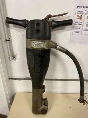 a black and silver fire extinguisor on top of a table