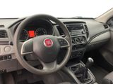 the interior of a car with a steering wheel, dashboard, and dashboard controls