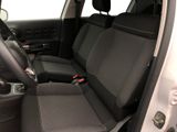 the interior of a car with black seats and a steering wheel