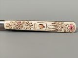 a close up of a pen with a design on it