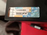 a black box with a ticket on it sitting on a table