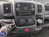 a dashboard of a truck with a radio and other controls