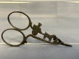 a pair of scissors that are sitting on a table