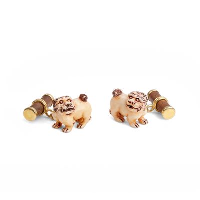 pair of gold tone cufflinks with a pug design