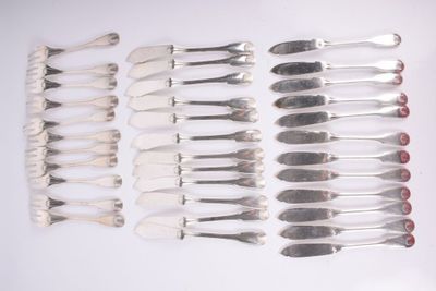 a lot of forks and spoons sitting on a table