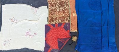 several different types of cloths laid out on a black surface