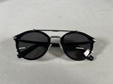 a close up of a pair of sunglasses on a white surface