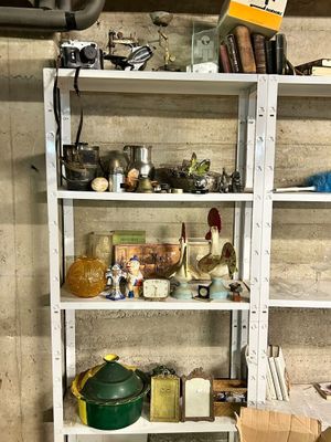 a shelf with various items on it in a room