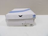 a white box with a blue stripe on it on a table