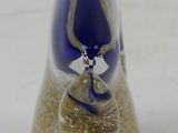 a glass figurine that is sitting on a table