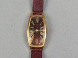 an image of a wrist watch with roman numerals on it
