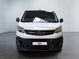 the white van is parked in a white room with a black floor