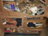 a cardboard box with many items in it sitting on a carton