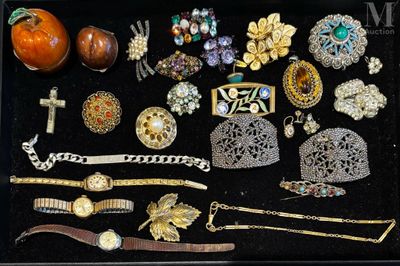 many different types of jewelry displayed in a display case