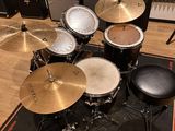 the drum kit is ready to be used in the recording room