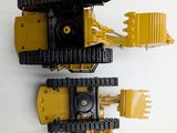 a yellow and black toy truck and a yellow and black toy truck
