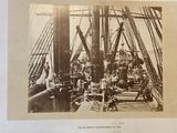 a black and white photo of a ship with people on it