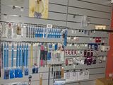 a wall with many different items on it in a store