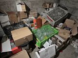 a pile of boxes and boxes sitting on the ground