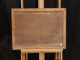 an old wooden easel with a blank board on top of it