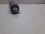 a black pen that is laying on a white surface