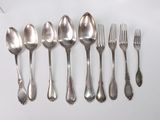 six spoons and six forks are lined up on a white surface