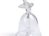 a glass bell with a bird on it on a white background