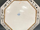 a white plate with a gold border on it