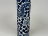 a blue and white vase with a dragon on it