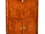 an antique chest of drawers with two doors and two drawers on each side