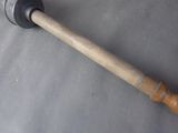 a large hammer that is laying on a table