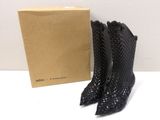 a pair of black leather boots with a box on the side