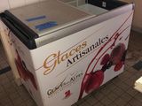 an ice cream machine sitting on the floor in the kitchen