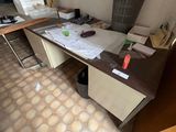 a desk that has a lot of papers on it