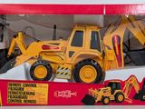 a yellow toy bulldozer with a remote control