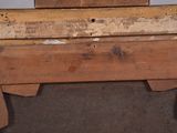 a wooden table with a mirror on top of it