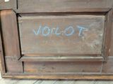a wooden door with the word vollot written on it