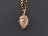 a gold locke with an image of a woman on it