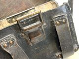 an old suitcase that is open on a white surface
