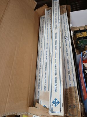 a cardboard box full of books and other items