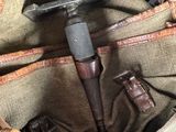 a bag with a hammer inside of it on a table