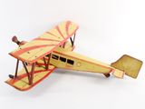 a toy airplane that is sitting on a white surface