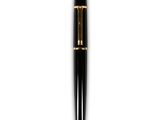 a close up of a pen on a white surface with a white background