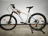 a bike that is parked in front of a garage door