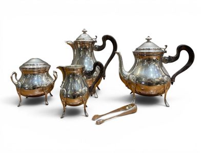 three pieces of silver tea and coffee set on a white surface