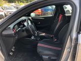the interior of a car with black seats and red trims