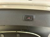 a close up of a car ' s dashboard with a button