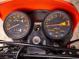 a close up of a motorcycle with a speedometer and gauges on it