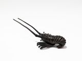 an image of a toy lobster on a white surface