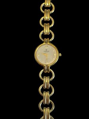 an image of a close up of a wrist watch on a black background